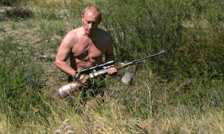 Vladimir Putin carries a hunting rifle during his trip in Ubsunur Hollow in the Siberian Tyva region in 2010.