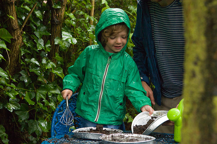 National Trust Hargreaves: National Trust: George Hargreave making mud pies with his parents