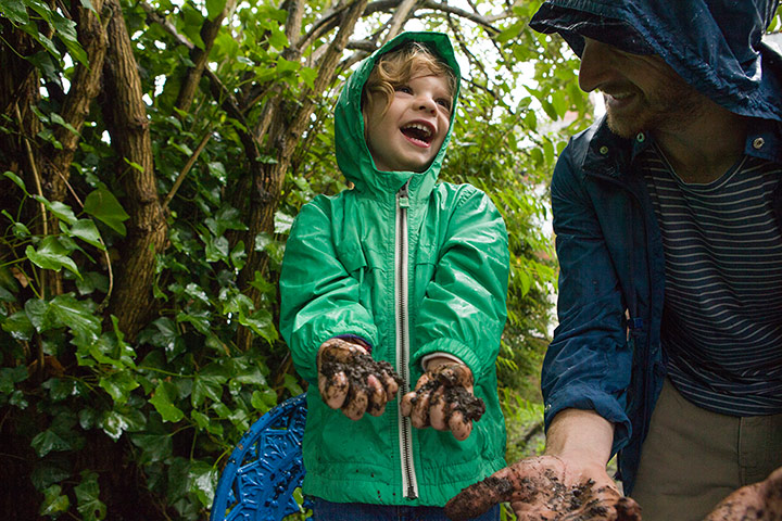 National Trust Hargreaves: National Trust: George squeezes mud through his fingers