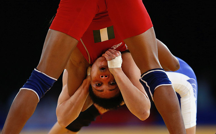 weirdsport: Nigeria's Ifeoma Nwoye looks surprised by Canada's Brittanee Laverdure 
