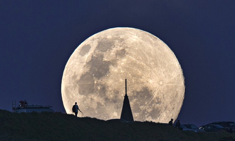 The perigee moon, or supermoon rises over Mount Eden in Auckland, New Zealand on Sunday morning.