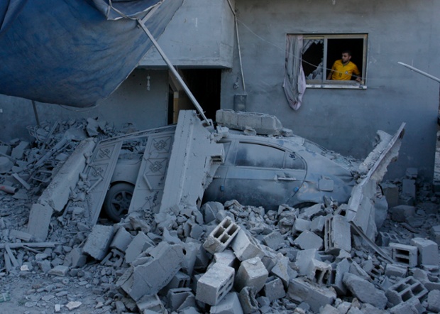 Rafah, Gaza: A Palestinian man looks out at destruction caused by an Israeli airstrike.