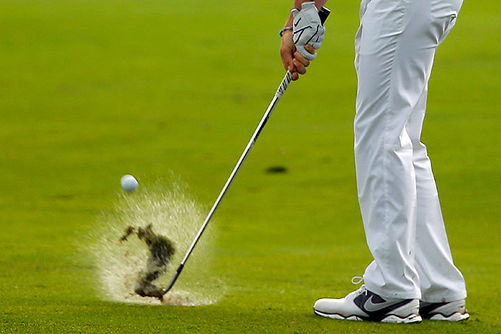 Rory McIlroy US PGA Open: Rory McIlroy of Northern Ireland hits off a wet fourth fairway