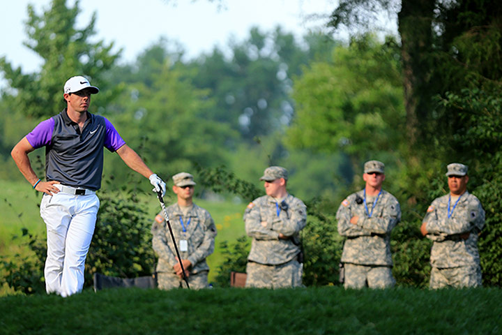 Rory McIlroy US PGA Open: Rory McIlroy of Northern Ireland is watched by United States armed forces