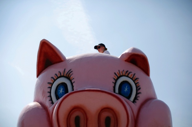 A worker is seen on the top of a ride at the Wisconsin State Fair in West Allis, US