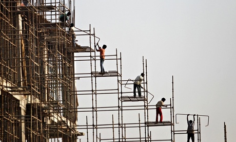 Labourers work at the construction site of a commercial complex in New Delhi