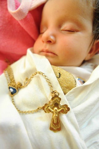A nine-day-old Assyrian baby sleeps inside a church in Irbil, Iraq