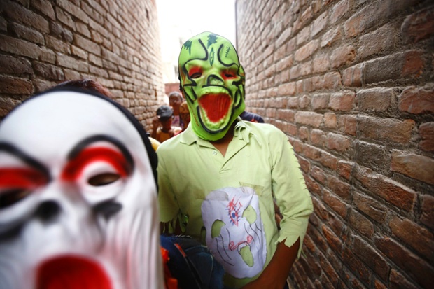 People take part in a parade commemorating the Neku Jatra-Mataya festival, the festival of lights, in Lalitpur, Nepal