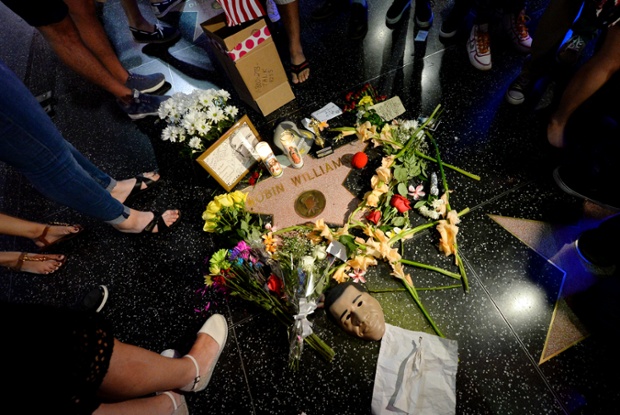 Flowers are placed on Robin Williams star on the Walk of Fame in Hollywood, Los Angeles.