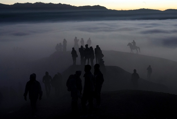 Villagers stand on Mount Bromo during the Kasada ceremony in Probolinggo, Indonesia