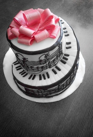 'Piano cake: I made this for my mother-in-law who composes music. The music on the side is the first piece she composed.'