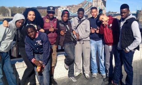 temi mwale with a group of young men by tower bridge