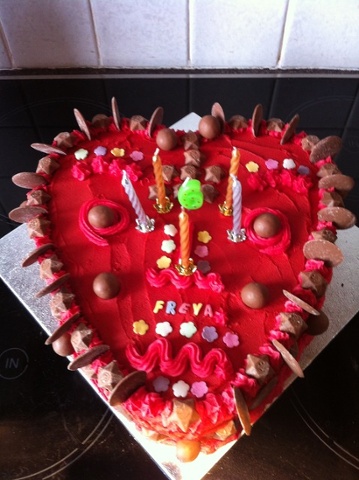 'Scary mask - by my daughter (then aged 6): This cake was entirely designed by my daughter for her 6th birthday. I made the cake and spread the cream on, and she chose all the colours / decorations / design etc. I don't think it was supposed to be as scary as it is...'