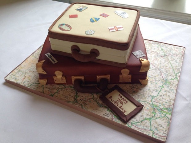 'A travel mad 70year old's birthday cake: My sister made this for our father's 70th birthday to represent some of the places he has visited, due to his continually itchy feet! She's a genius and one 'case' was even gluten free especially for Dad.'