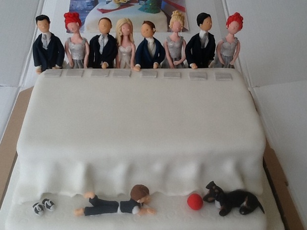 'The top table: My brother asked for a bridal party cake for his friends, including the five year old page boy and their lovely dog Penny.'
