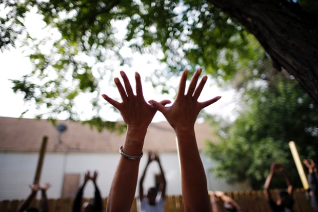 Hands up: a community yoga class in Chicago, Illinois