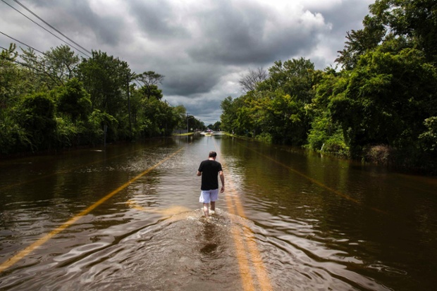 A flooded road in Islip, New York after more than a foot of rain hit parts of Long Island on Wednesday