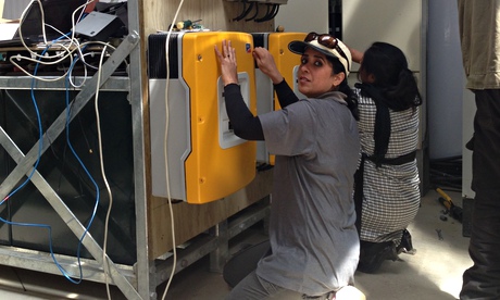 Woman and solar plant