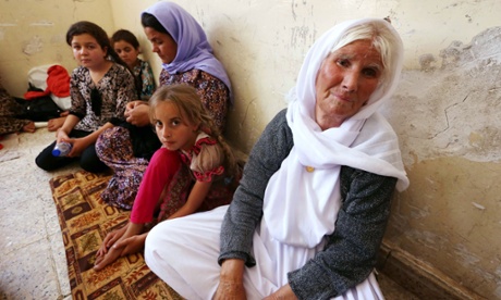 An Iraqi Yazidi family that fled the violence in Sinjar take shelter in the Kurdish city of Dohuk.