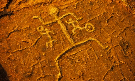 Petroglyph man on red rock, Puako, Hawaii