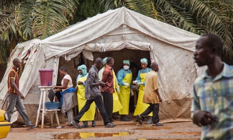 Health workers screen people for the deadly Ebola virus before they enter a hospital in Sierra Leone.