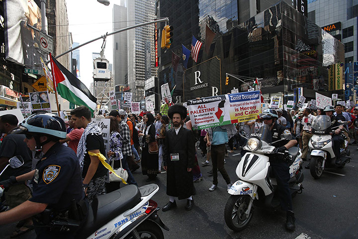 20 Photos: An Orthodox Jew joins Palestinians taking part in a protest in New York