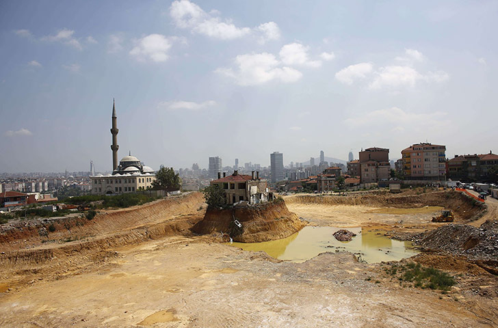 20 Photos: A lone house is seen at the construction site in Fikirtepe, Turkey
