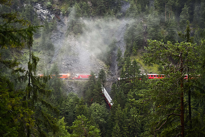 20 Photos: A train after being derailed by a landslide near Tiefencastel, Switzerland