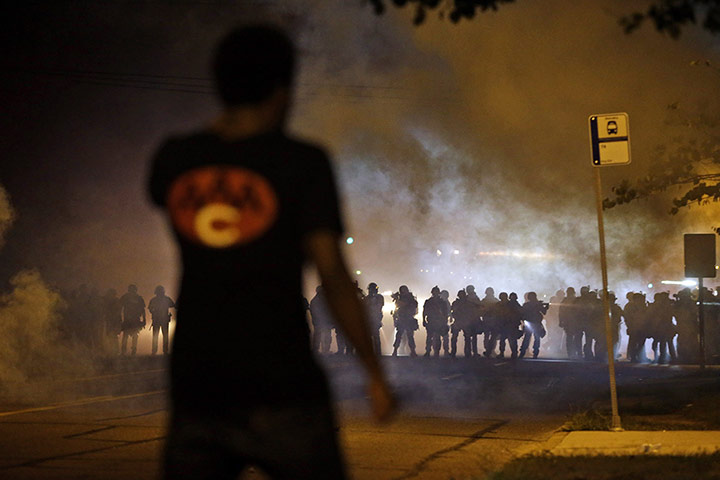 20 PHOTOS: A man watches clashes in Ferguson, Missouri