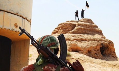 An image downloaded from the jihadist website Welayat Salahuddin shows militants of the Islamic State of Iraq and the Levant (ISIL) waving the trademark Islamists flag.