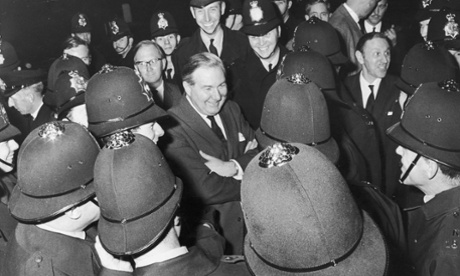 27th October 1968:  Foreign Secretary James Callagahan surrounded by police during an anti-Vietnam demonstration outside the US Embassy.