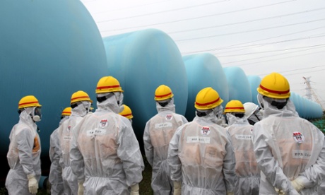 Members of the Japan Nuclear Regulation Authority inspect makeshift water storage tanks at the Fukushima nuclear power plant. Photograph: Japan Nuclear Regulation/EPA
