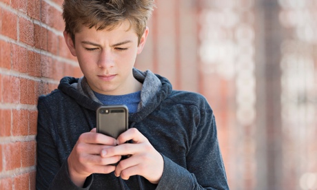 Teenage boy on phone