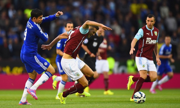 Burnley kick off at a very loud Turf Moor. Here   Jason Shackell is put under early pressure by Chelsea debutant Diego Costa.