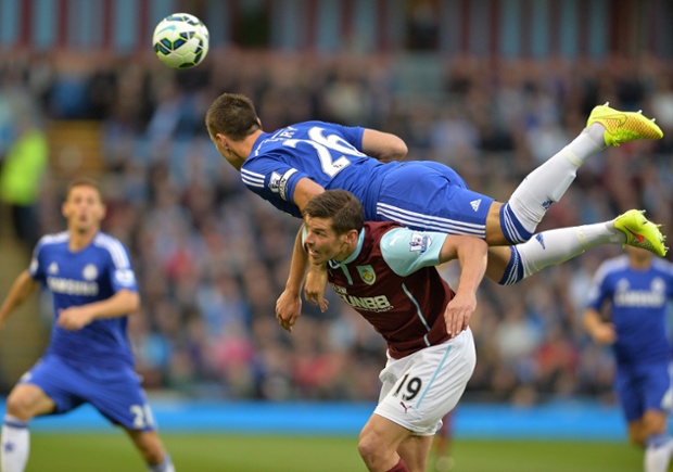 John Terry challenges Burnley's main summer signing, Lukas Jutkiewicz.