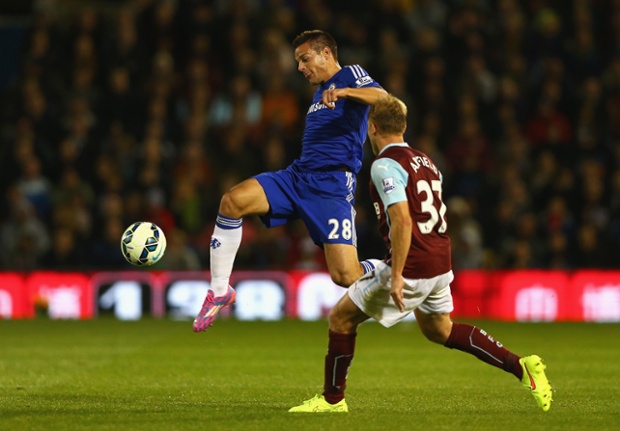 Cesar Azpilicueta in control despite pressure from Scott Arfield.