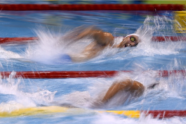France's swimmer Jeremy Stravius (back) competes to win gold in the 4x100m Freestyle Men final event at the 32nd LEN European swimming championships in Berlin, Germany.