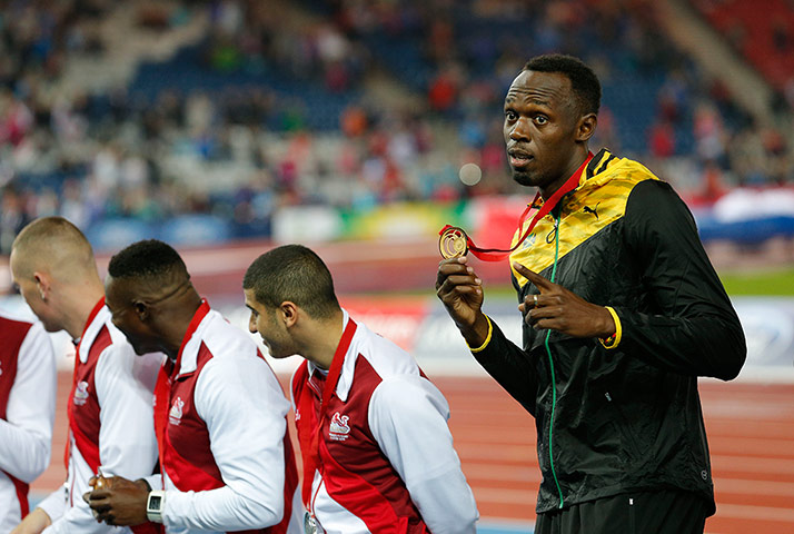 Usain Bolt by Tom Jenkins: Usain Bolt with gold medal