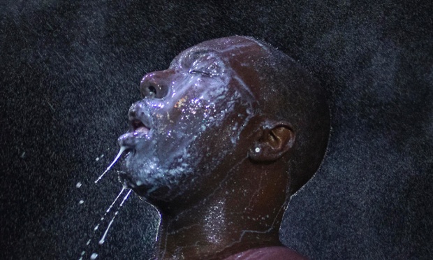 A man is doused with milk and sprayed with mist after being hit  in Ferguson, Missouri