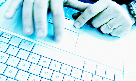 Man's hands at computer