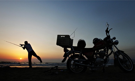 man fishing and motorcycle 