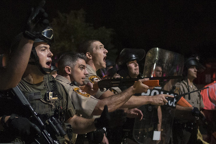 20 Photos: Security forces charge at a protest against the death of Michael Brown