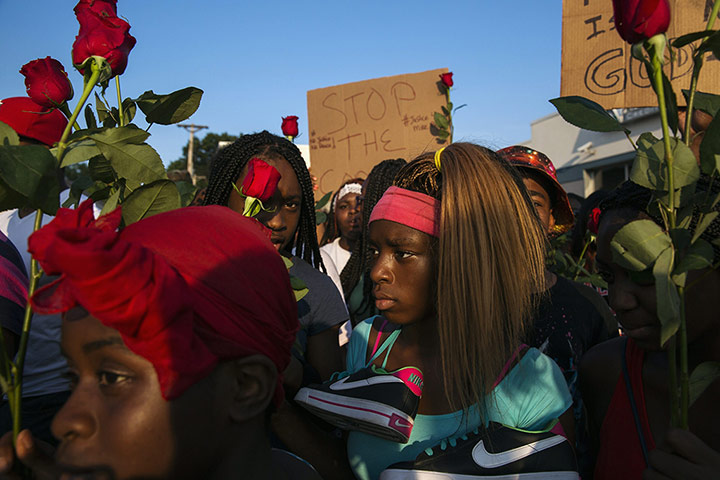 20 Photos: People walk during a peaceful march for Michael Brown in Ferguson