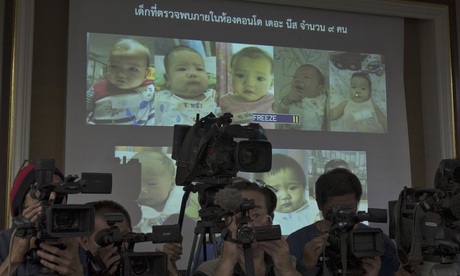 Thai police display pictures of the surrogate babies