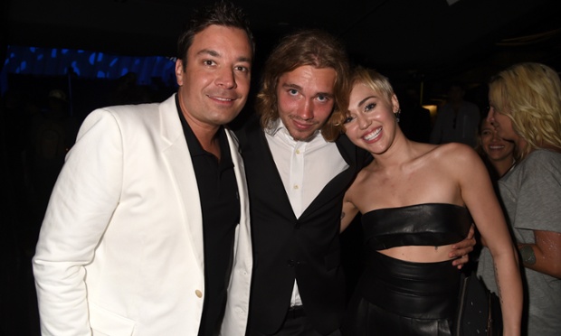Comedian Jimmy Fallon, My Friend's Place representative Jesse, and recording artist Miley Cyrus attends the 2014 MTV Video Music Awards.