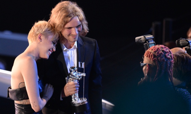Miley Cyrus with Jesse - a homeless man who she sent to accept her Video of the Year award for 'Wrecking Ball' at the MTV Video Music Awards in California - to give the issue exposure