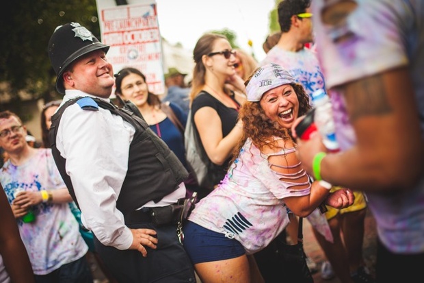 policeman and lady dancing during the notting hill carnival