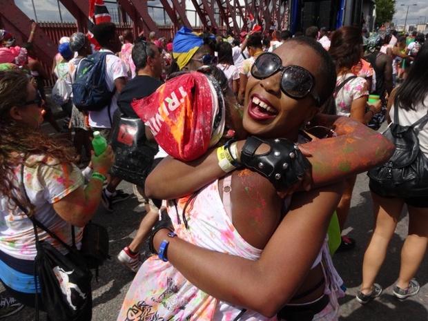 two women embracing at the notting hill carnival