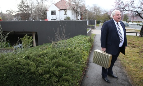 Clive Palmer arrives for a morning meeting of the Palmer United Party at their offices  in the National Press club building, Tuesday 26th August 2014