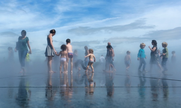 People cool off in the Water Mirror in Bordeaux